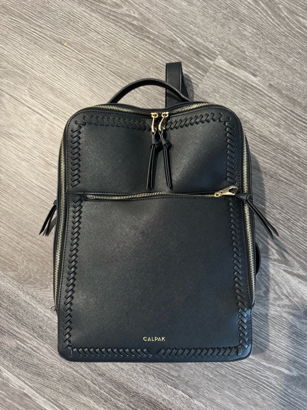 Calpak Black Backpack with Gold Hardware and Woven Trim